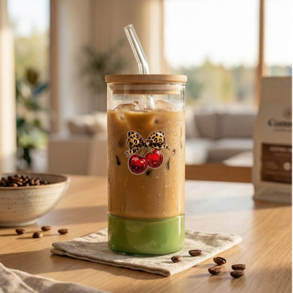 Green shaded glass tumbler with a printed cherry bow design, Bamboo lid and glass straw